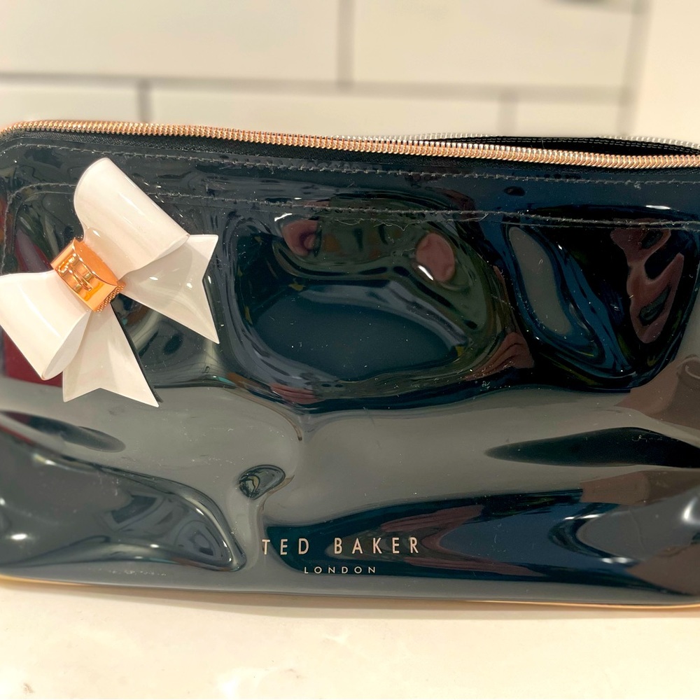 Black Ted Baker large makeup bag with rose gold bottom